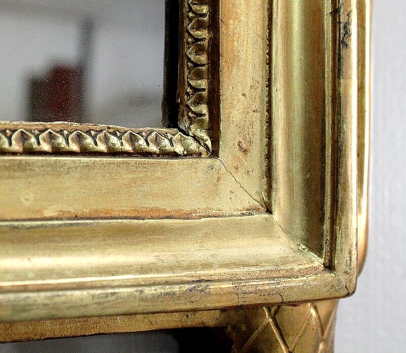 Miroir en bois doré, style Louis XVl, début XXe
