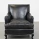 Armchair in black grained cowhide leather with a deep seat