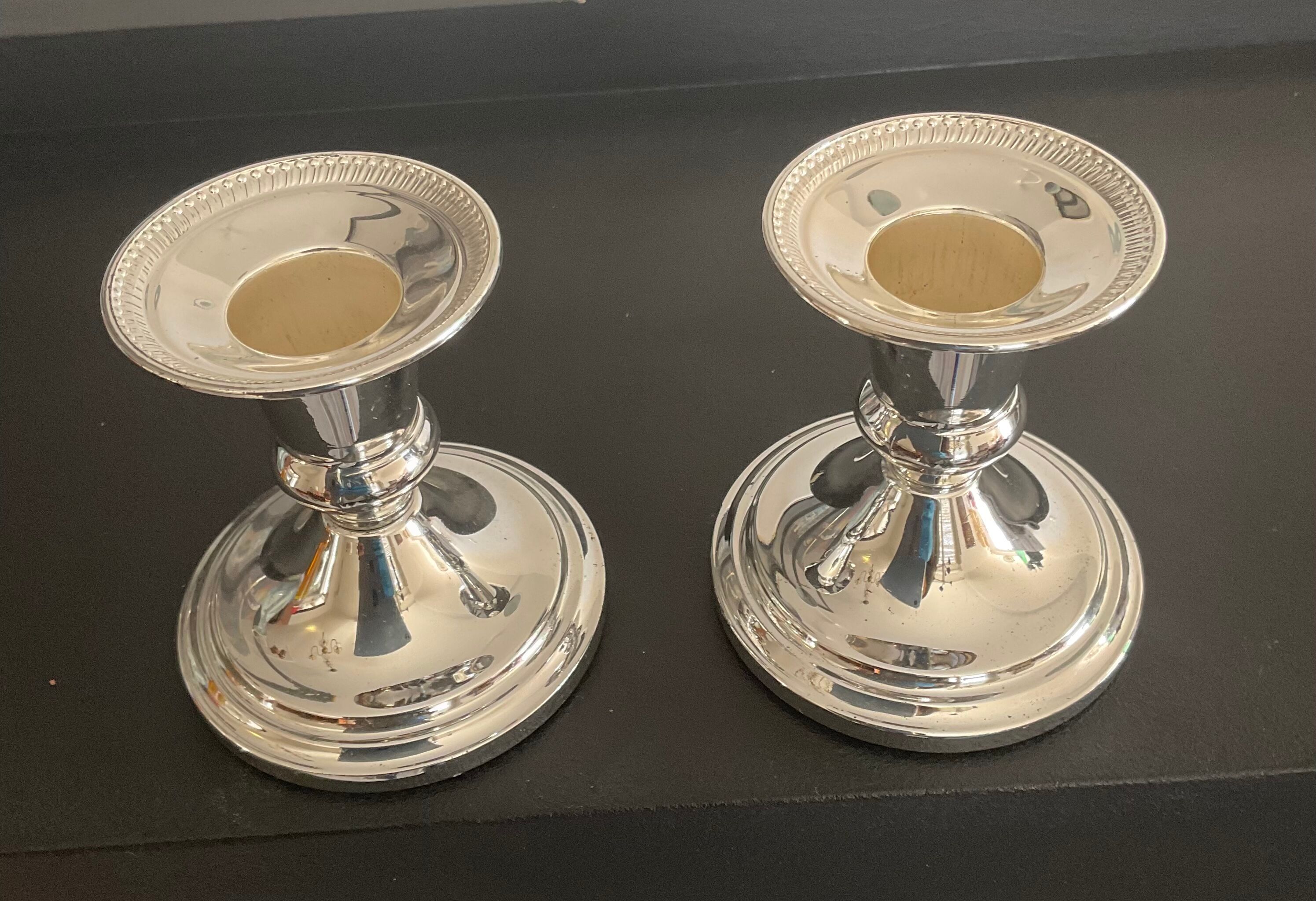 Pair of vintage candle holders in silver metal