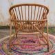 Fauteuil vintage « coquille » en rotin