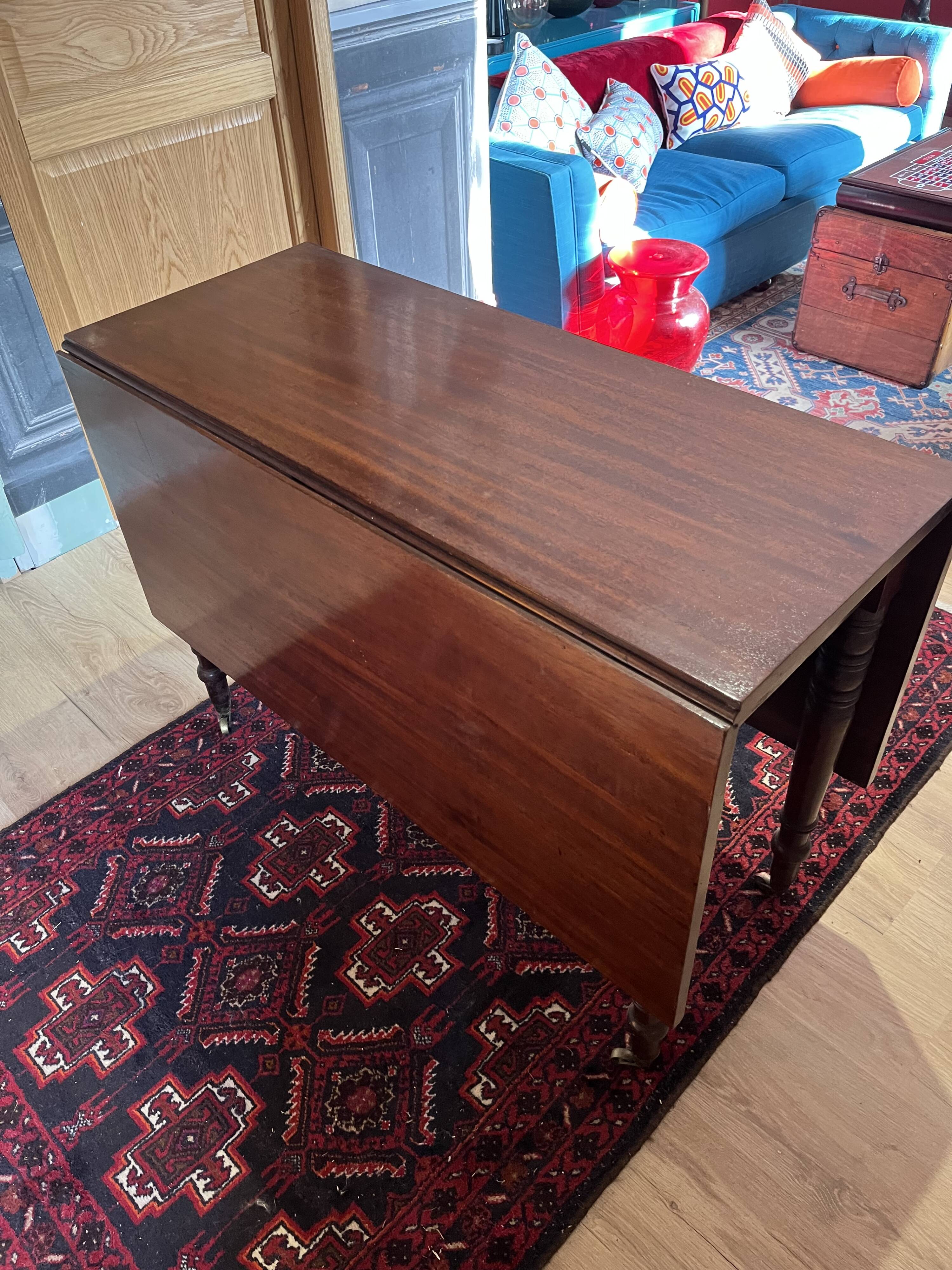 Vintage drop-leaf mahogany table; ideal for decorators.