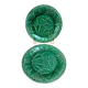 Set of 2 green earthenware dessert plates with vine decoration.