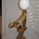 Lamp depicting a with a drape