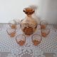 Pink glass liqueur carafe and 6 matching glasses