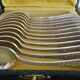 12 dessert spoons Apollo silver metal 1920 in case