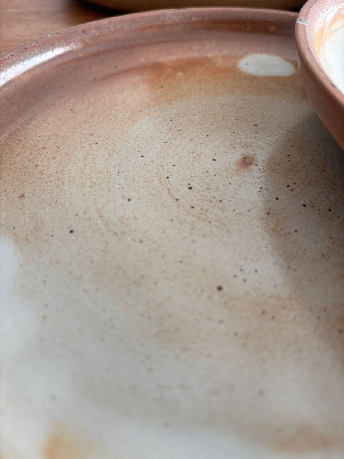 Set of vintage 1970s beige ceramic dinner plates.