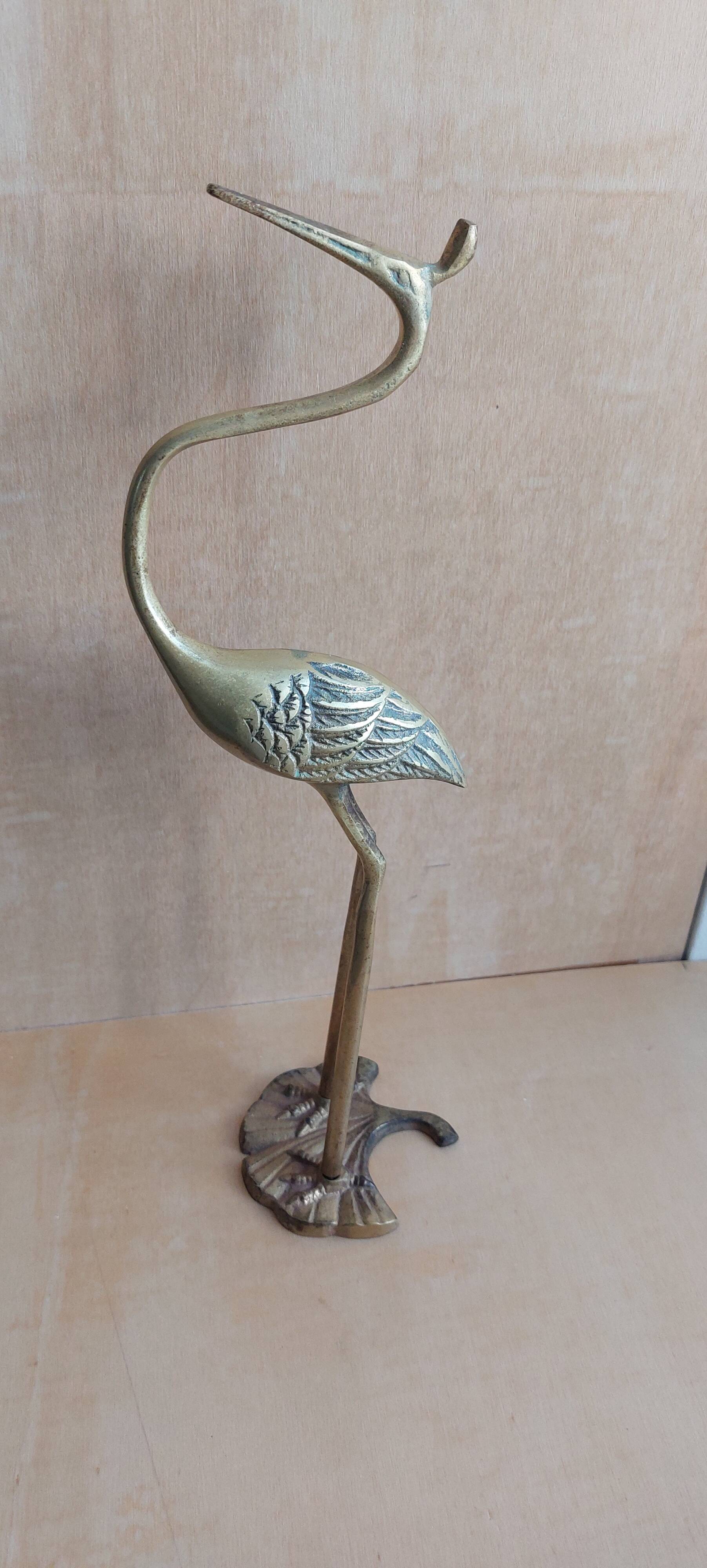 Heron bird in vintage golden brass