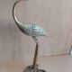 Heron bird in vintage golden brass