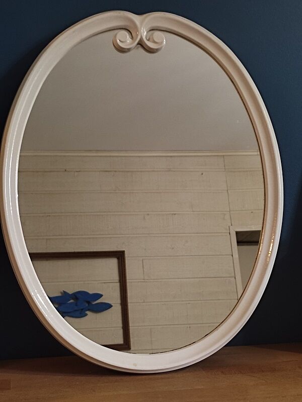 Oval mirror patinated white enamelled metal frame