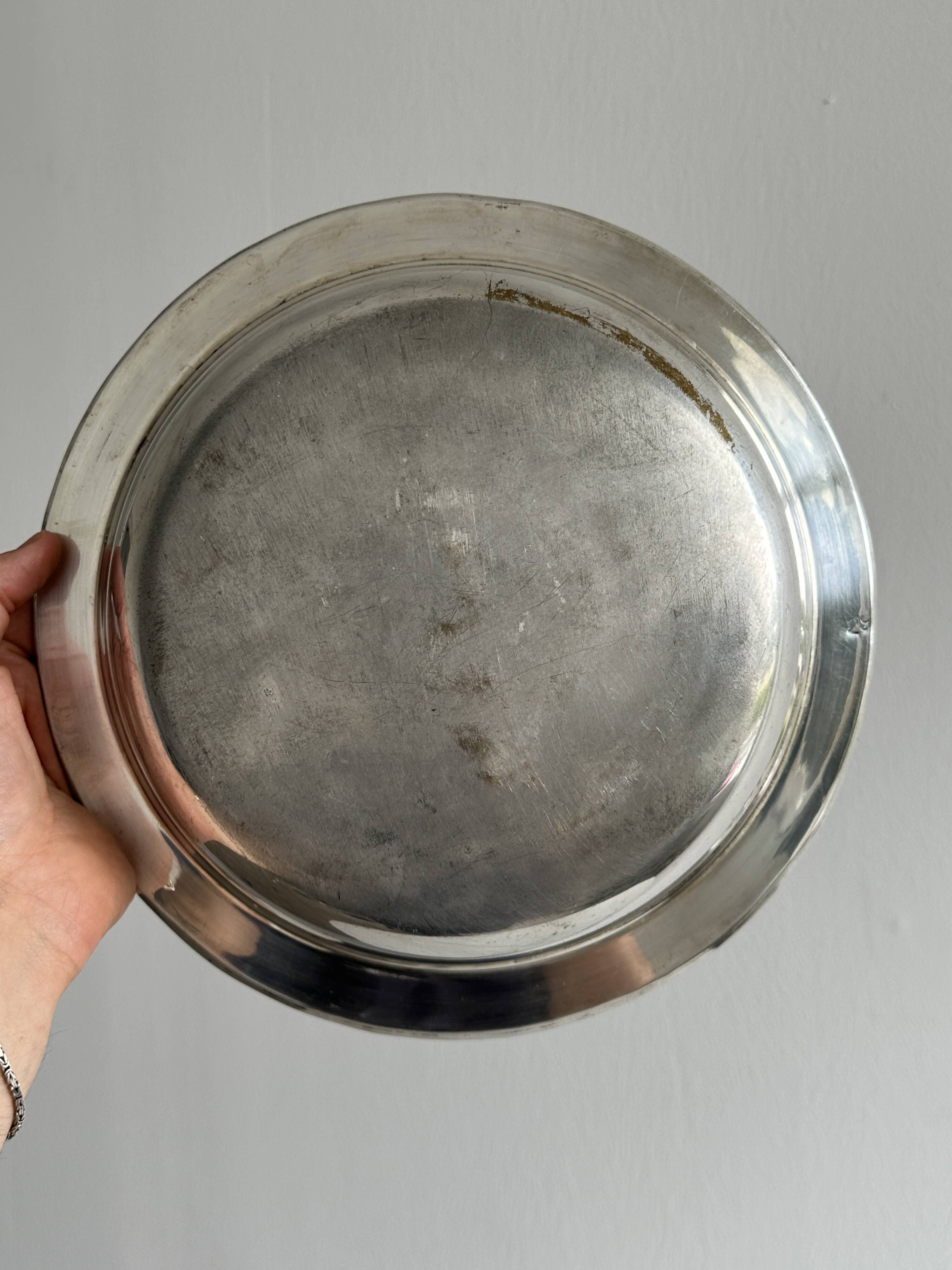 Antique round salad bowl or dish in shiny silver metal