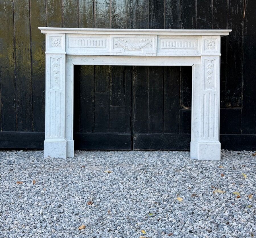 Louis XVI style fireplace in white Carrara marble, circa 1880.