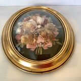 Golden oval frame dried flowers