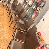 Many brown leather chairs "Roche Bobois"
