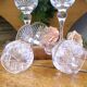 4 lead crystal wine glasses with slender baluster stems.