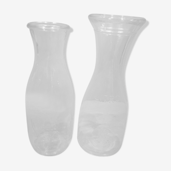 Duo of bottles carafes pitchers in transparent glass