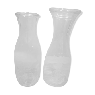 Duo of bottles carafes pitchers in transparent glass