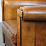 Sheep leather Art Deco design armchair finished with black piping