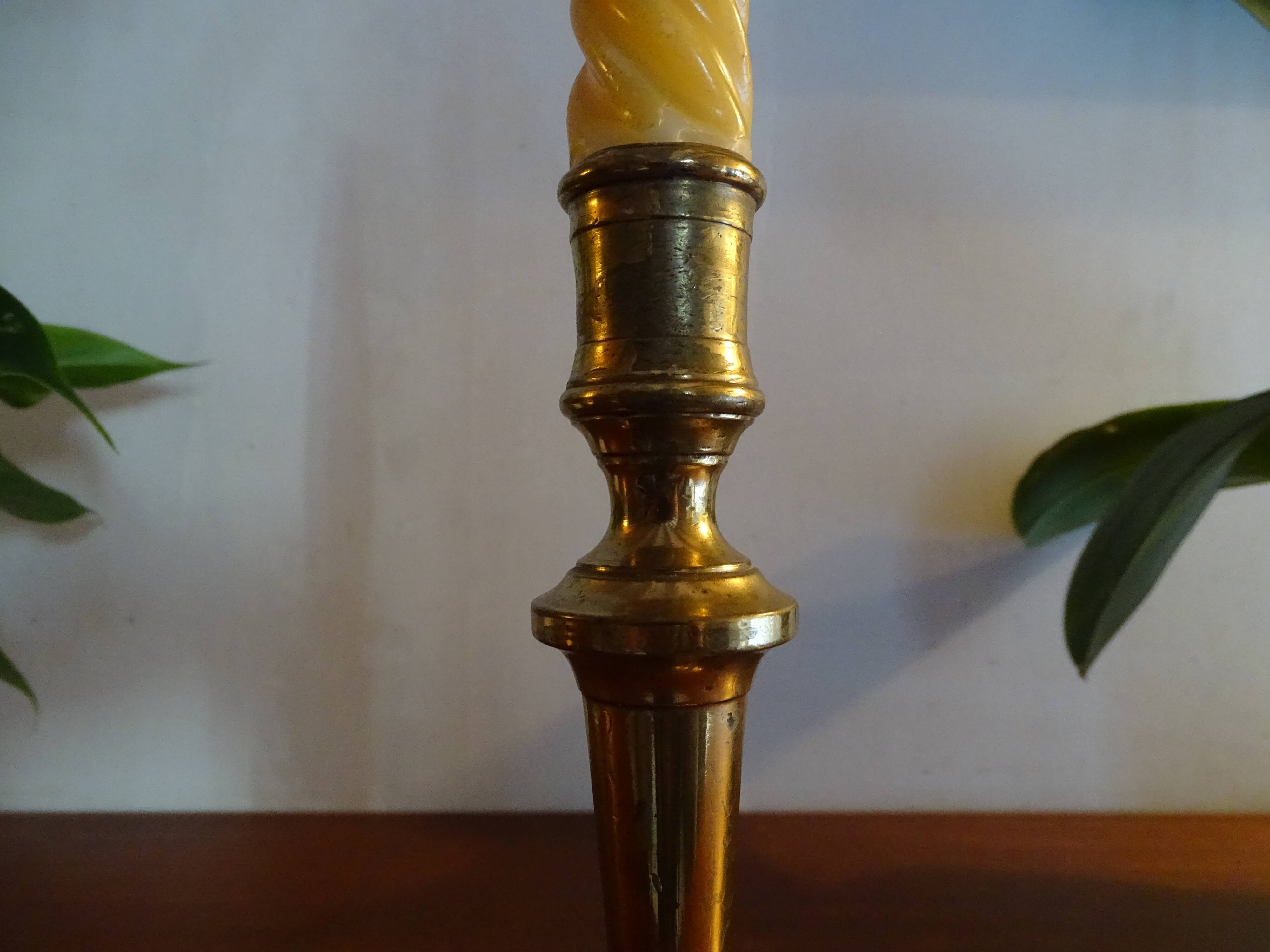 Old brass candle holder and its candle 21.5 cm