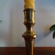 Old brass candle holder and its candle 21.5 cm