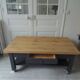 Coffee table on casters made from a vintage table, 1 drawer, 1 slate gray shelf.