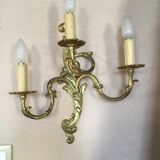 Louis XV-style wall light in solid bronze