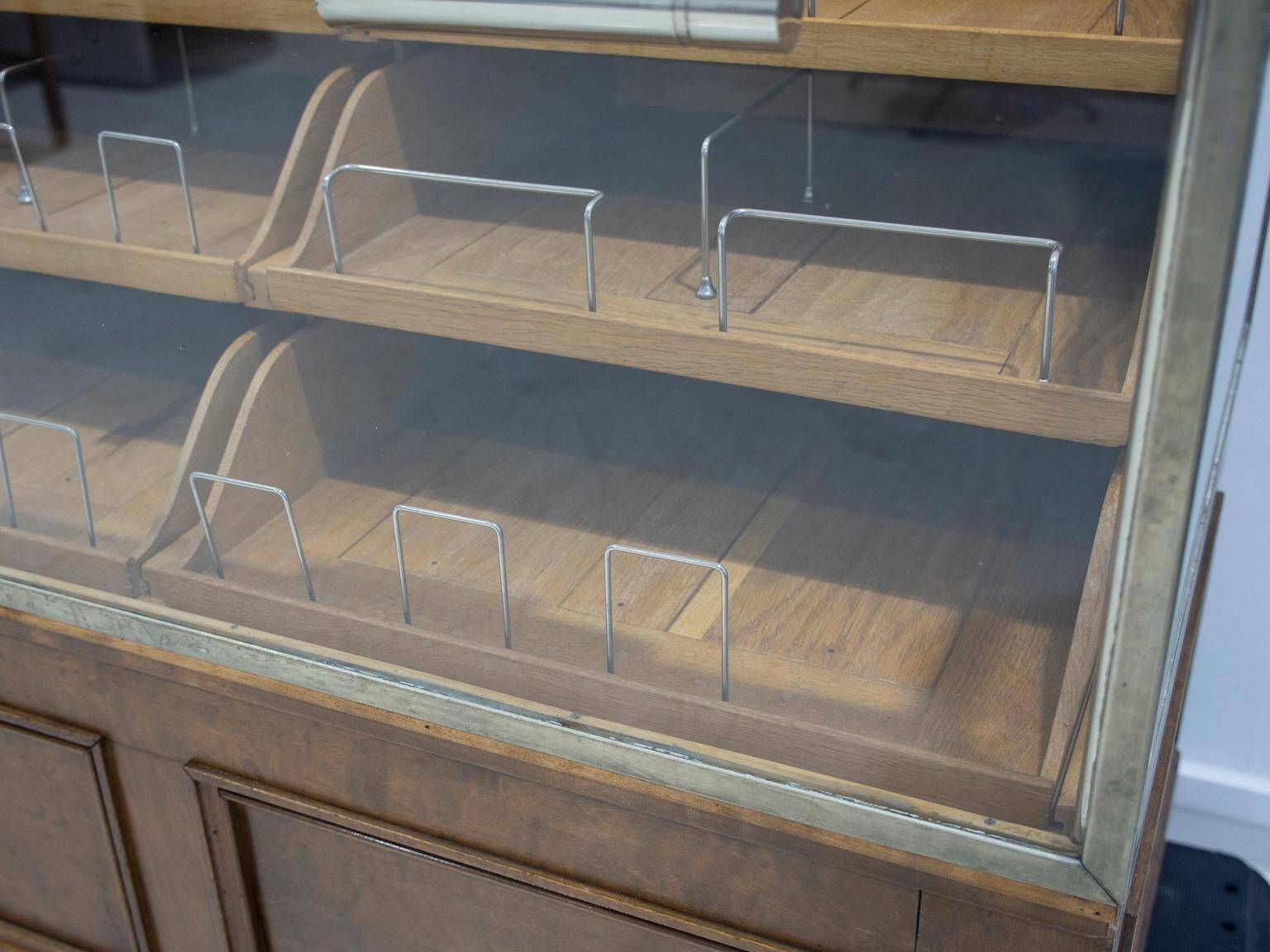 Shop counter made of birch and oak with twenty drawers, 1940s.