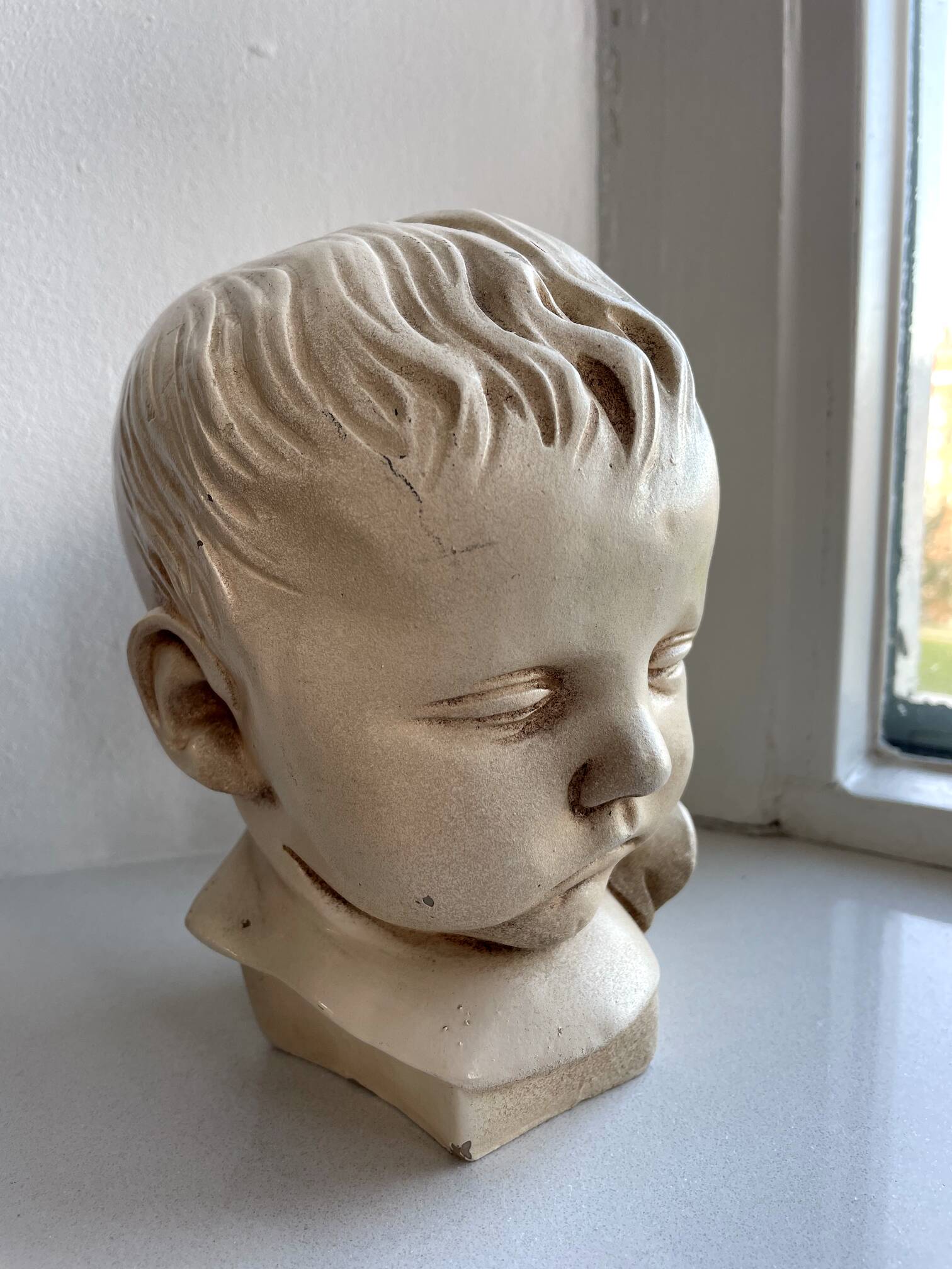 Child bust made from resin by Antoine Paridon, signed 240 A.P.