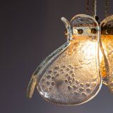 Swedish pendant with glass leaf shades and a center shade of amber coloured