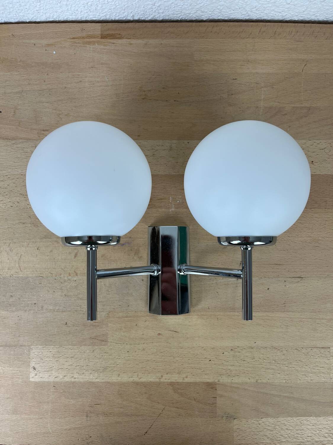 Opaline and chrome globe wall light from the 1970s