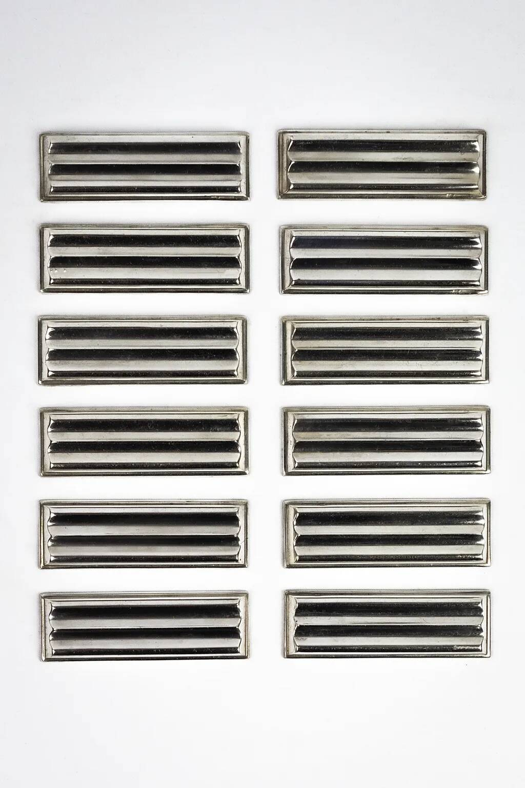 Christofle — 12 “Ondulations” knife rests by Luc Lanel, silver-plated metal