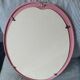 Vintage pink oval cast iron mirror
