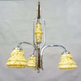 Antique Art Deco chandelier with three glass lampshades.