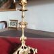 19th-century gilded bronze candlestick with leaf motifs, height 23.5 cm.