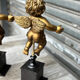 Pair of gilded cherubs on a Napoléon III base.