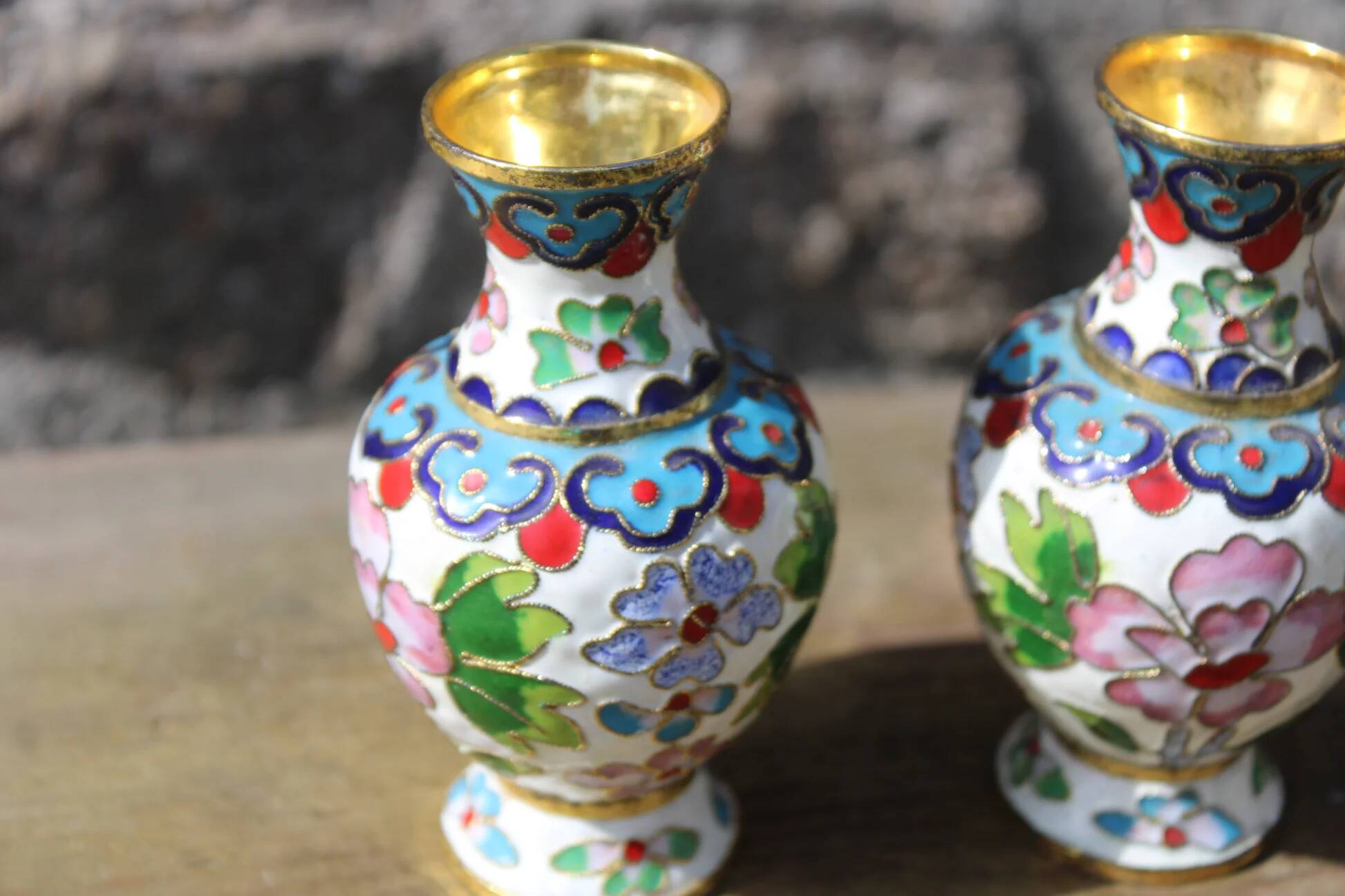 Two small vintage cloisonné enamel vases with Asian floral decoration.
