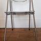 Chaise pliante en metal et plexiglas