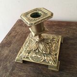 Old brass candle holder with square base