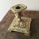 Old brass candle holder with square base