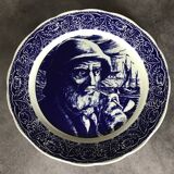 Blue enamelled earthenware wall plate with fisherman decor, Boch La Louvière, Belgium