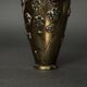 Pair of Japanese vases in chiselled bronze with inlaid bird decoration.