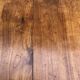 Antique solid cherry farmhouse table with 2 end drawers and 1 pull-out.