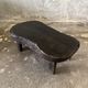 Small old Asian wooden coffee table in Japanese style, kidney-shaped top