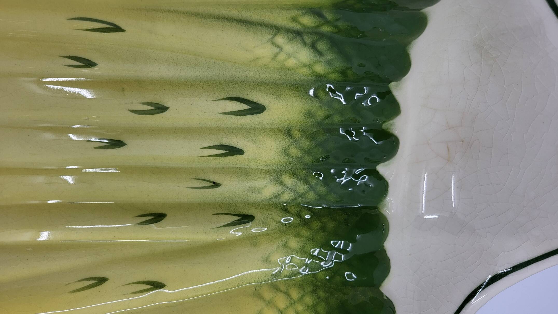 Salins earthenware slip dish decorated with asparagus, French, yellow and green, 20th century