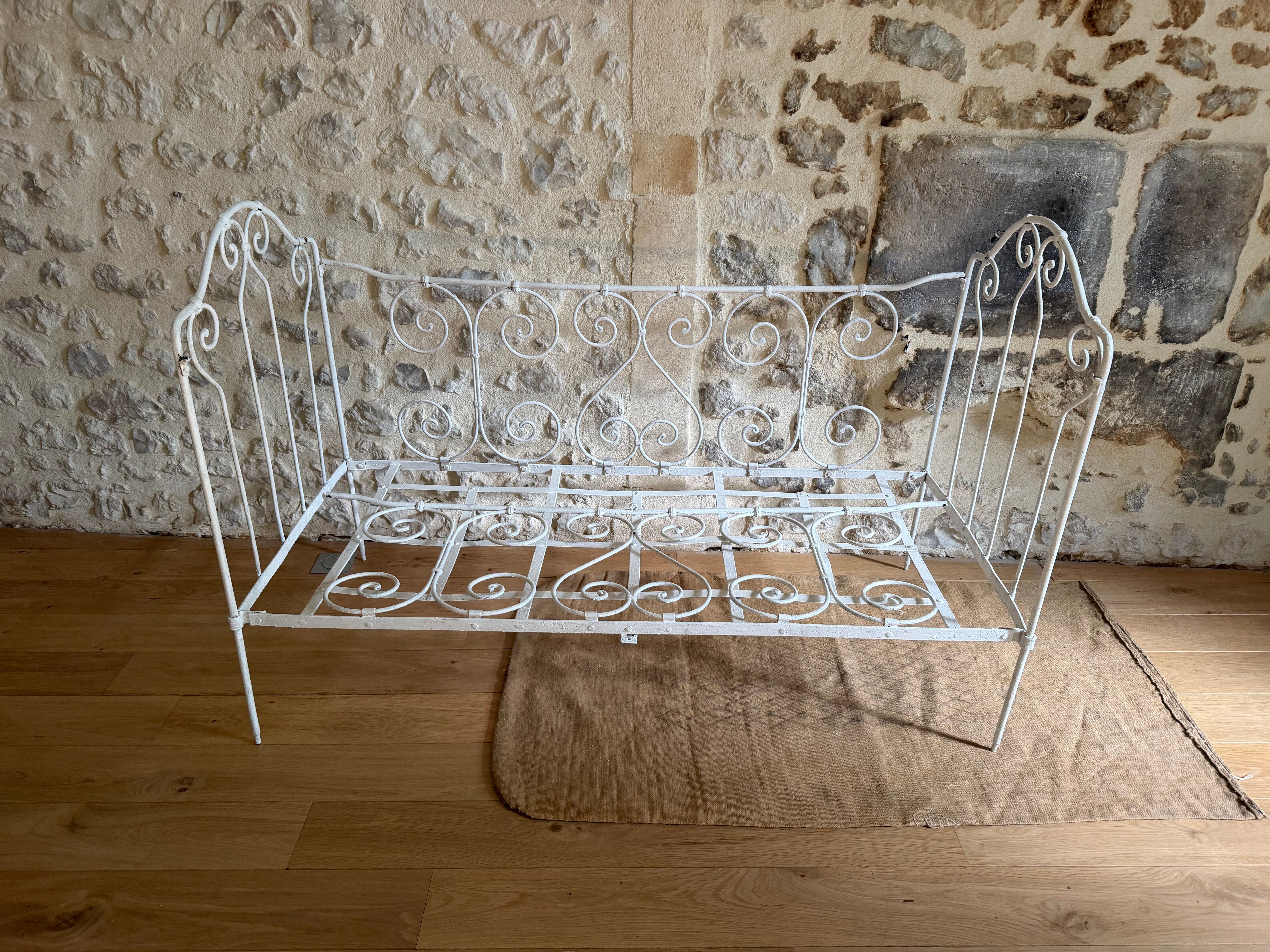 Small renovated wrought iron bed