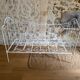 Small renovated wrought iron bed