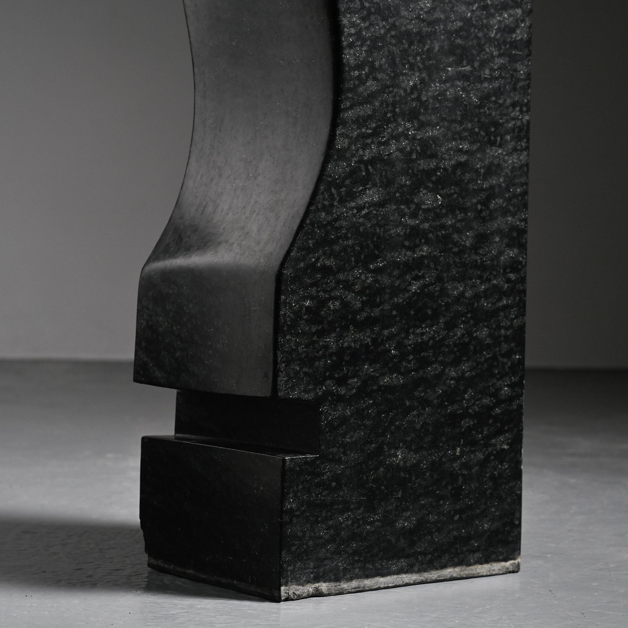 Abstract sculpture in diabase by Robert Neuhauser, Switzerland, circa 1985.