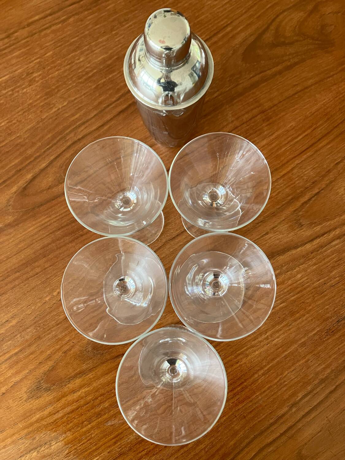 Shaker and five cocktail glasses