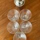 Shaker and five cocktail glasses