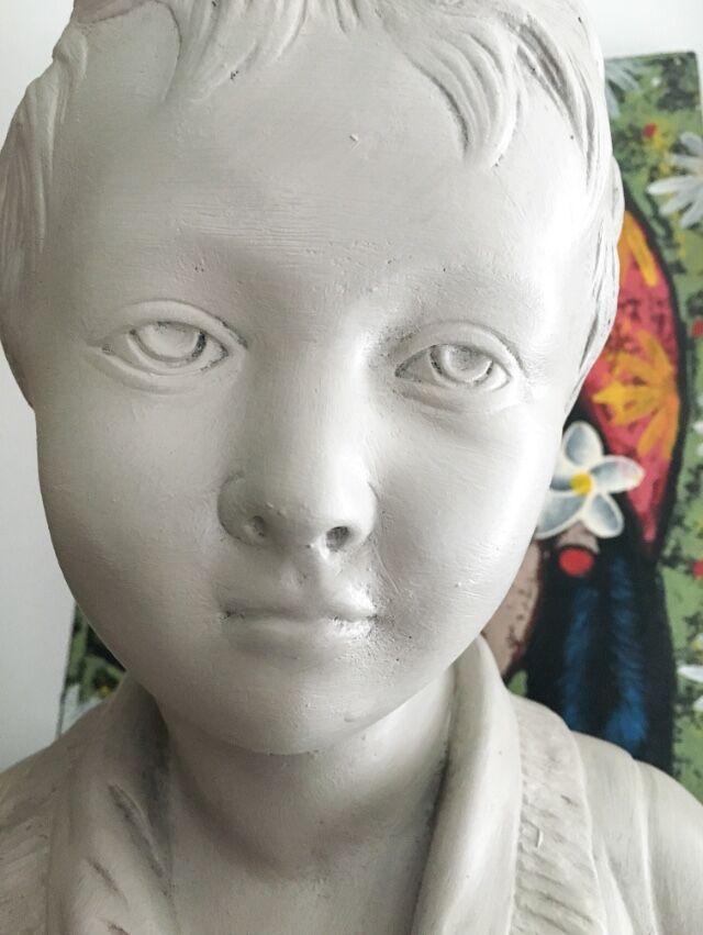 Cherub bust in platter