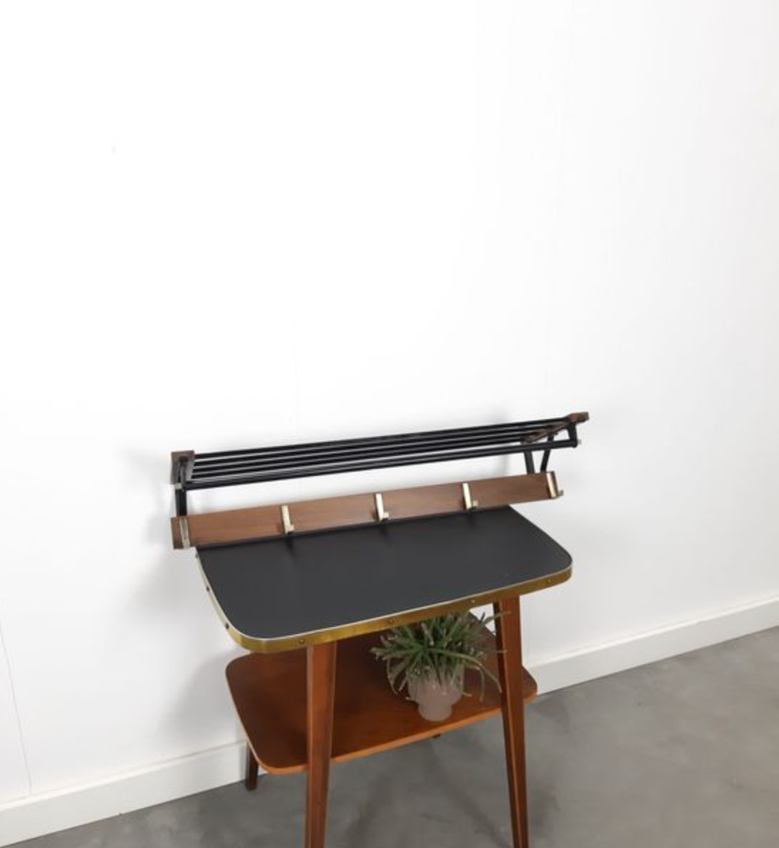 Vintage wooden wall coat rack with hooks and brass shelf